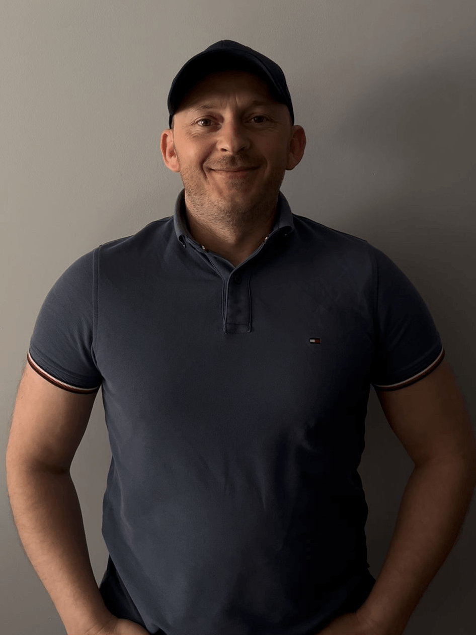 Volodymyr standing beside restored stone flooring